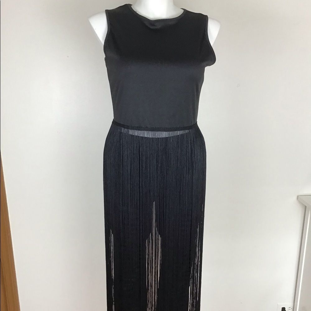 Black polyester string top size 3XL runs like a XL.